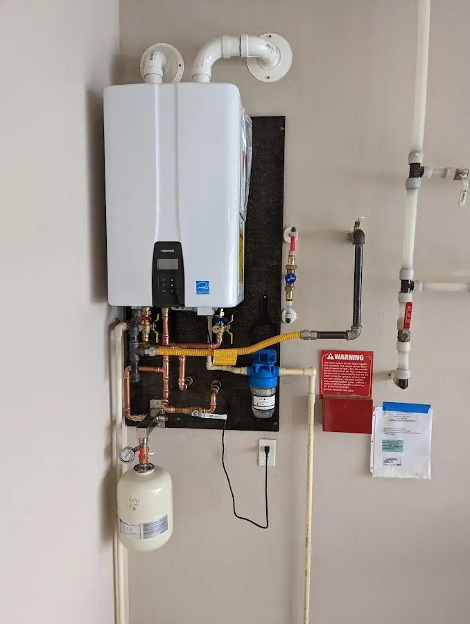 Professional plumber installing copper piping in a Dayton home